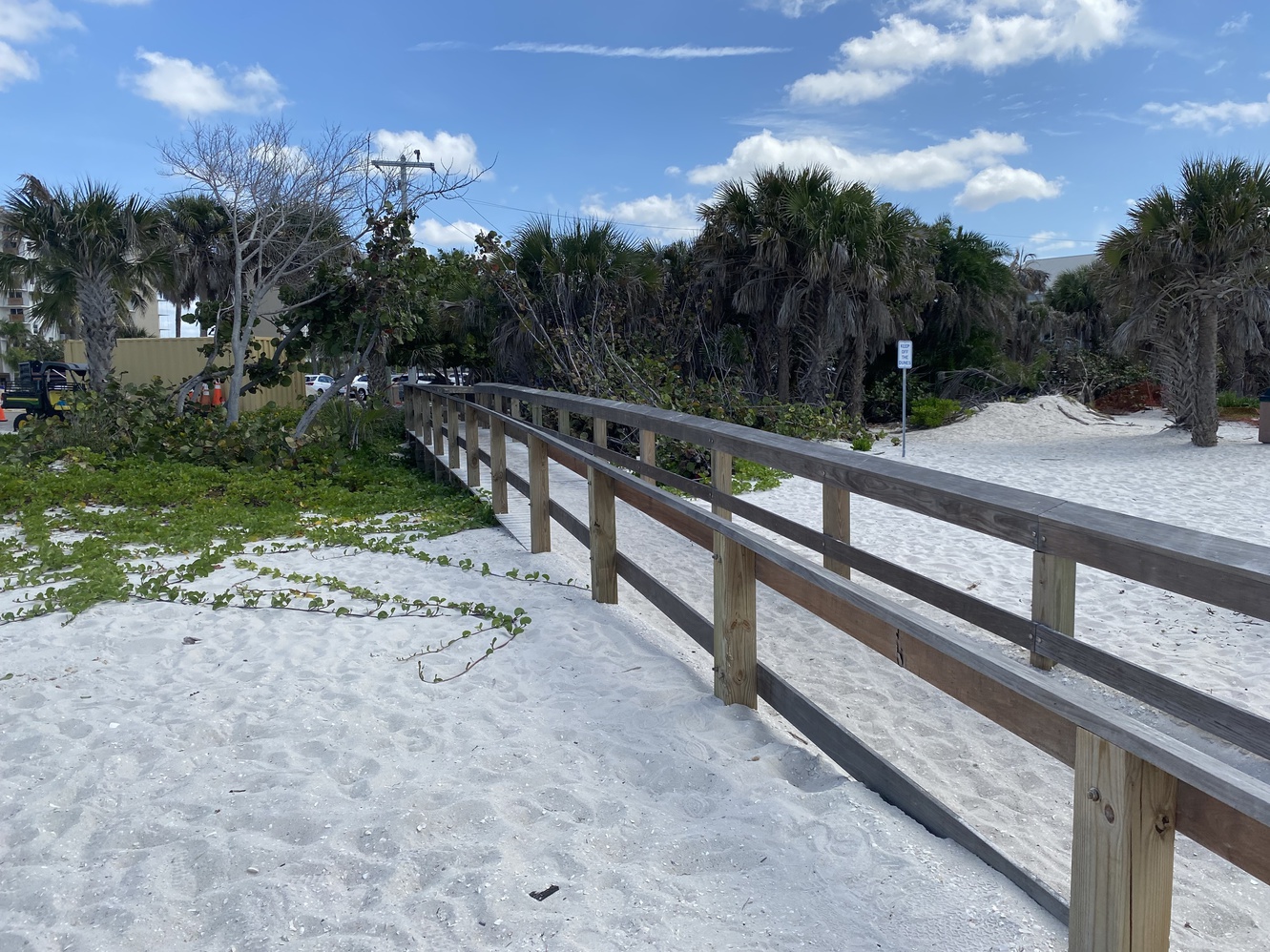 A sandy
      boardwalk at Bonita Beach.